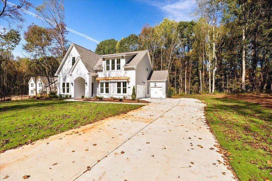 Front exterior of a new home in , Gainesville, GA, highlighting curb appeal (Image 22). Front exterior of a new home in , Gainesville, GA, highlighting curb appeal (Image 22).