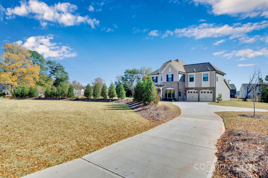 Front exterior of a new home in Whitaker Pointe, Huntersville, NC, highlighting curb appeal (Image 21).