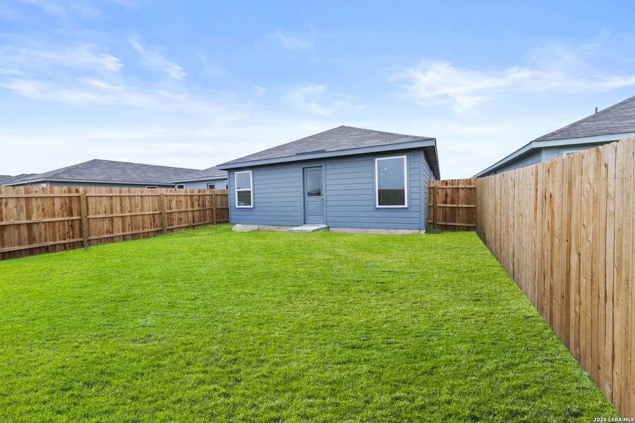 Exterior details and patio area of a home in Spring Grove, St. Hedwig (Image 2).