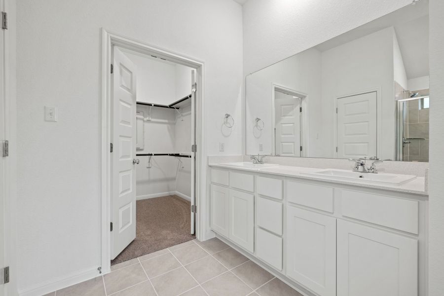 Primary Bathroom in the Quartz home plan by Trophy Signature Homes – REPRESENTATIVE PHOTO