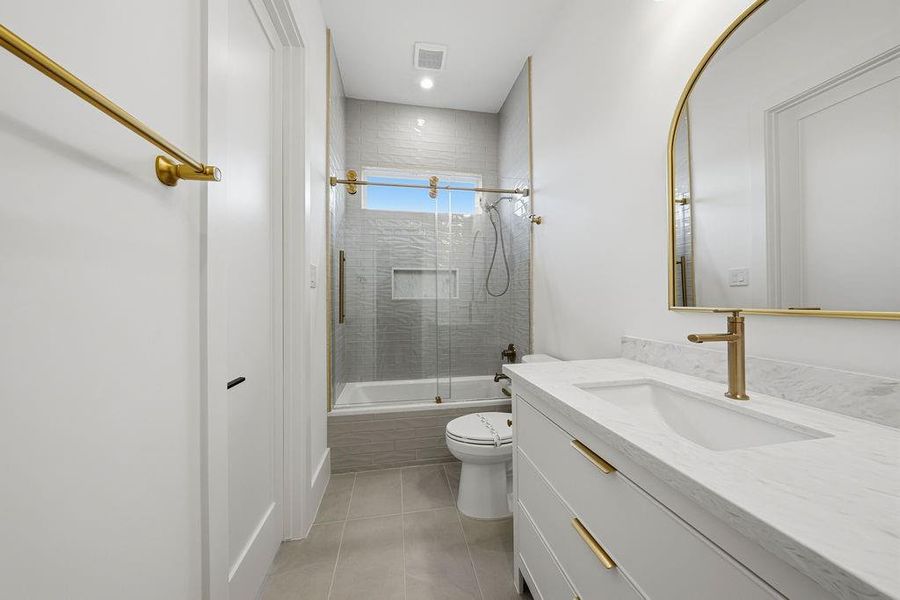 This secondary bathroom (#3) maintains the home's signature design language, blending sophisticated textures with high-end fixtures to create a bright and functional space.
