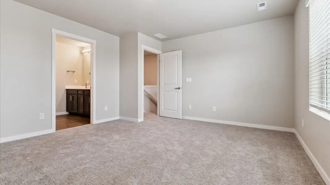 Spacious, unfurnished interior of a new home in Sky Ranch, Watkins (Image 15).