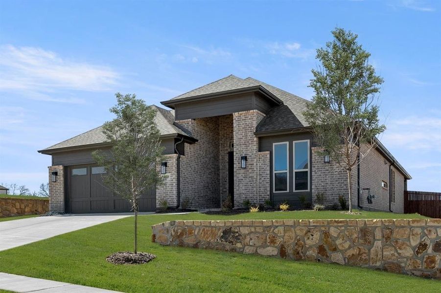 Front exterior of a new home in High Country, Burleson, TX, highlighting curb appeal (Image 23).