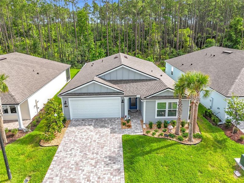 Front exterior of a new home in Sawmill Branch Express, Palm Coast, FL, highlighting curb appeal (Image 21).