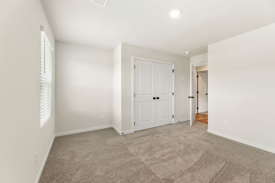A hallway with white doors. A hallway with white doors.