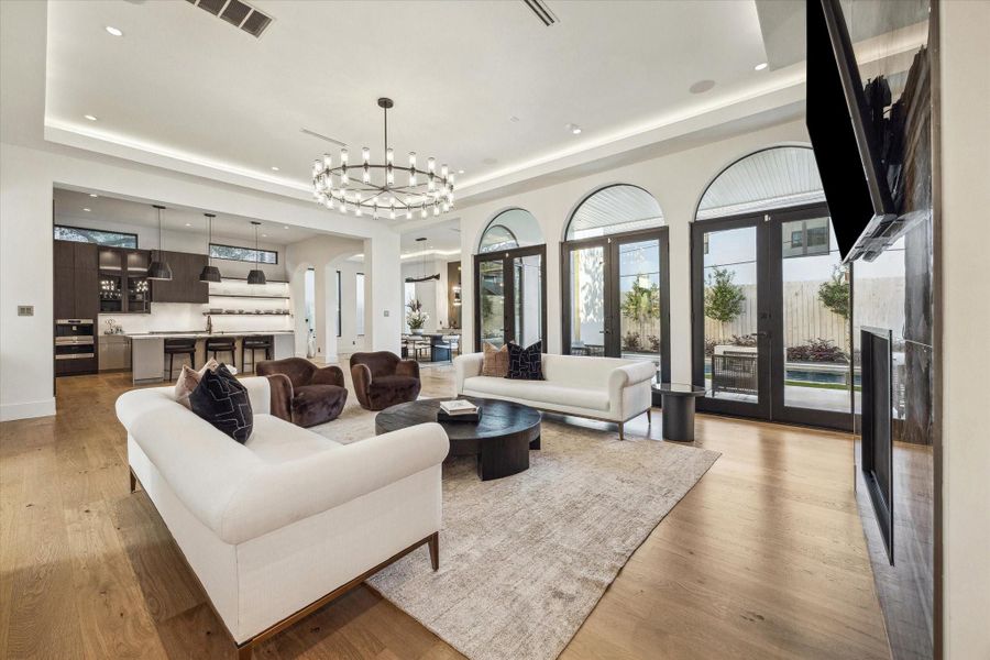 The living room flows seamlessly into the gourmet kitchen