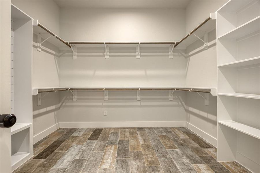 Huge primary closet with shelving