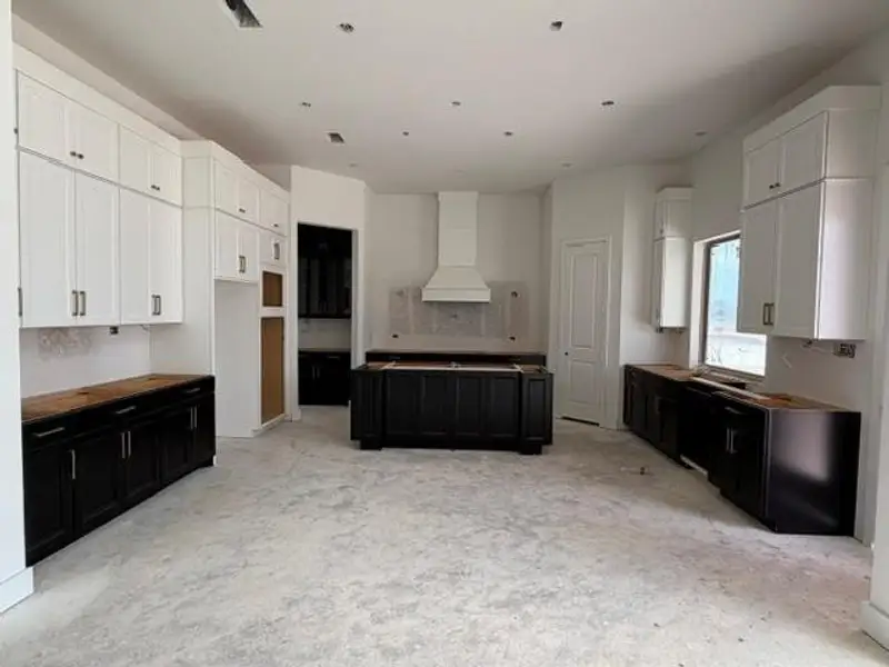 The kitchen features double ovens and soft-close drawers and doors. The kitchen features double ovens and soft-close drawers and doors.