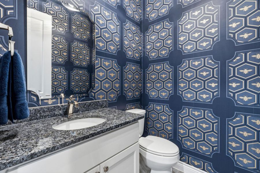 The stylish half bath features modern finishes and a polished designer feel. The stylish half bath features modern finishes and a polished designer feel.