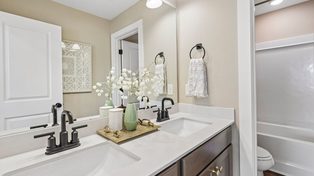 Secondary bathroom with dual vanity Secondary bathroom with dual vanity