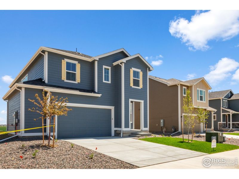 Front exterior of a new home in Granary, Johnstown, CO, highlighting curb appeal (Image 16).