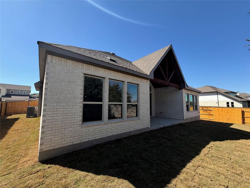 Exterior details and patio area of a home in Oaks at San Gabriel, Georgetown (Image 19).