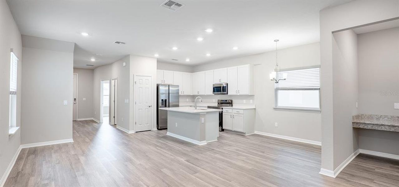 Furnished interior view inside a new home in The Crossings - Bungalows, St. Cloud (Image 4).