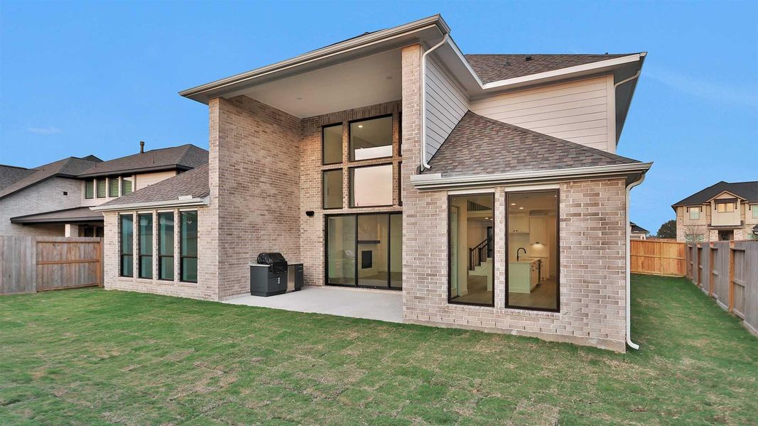 Exterior details and patio area of a home in Candela South 60', Richmond (Image 4).