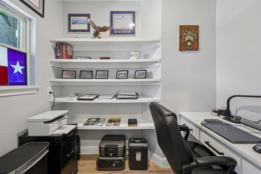 Office space with light wood-style floors and baseboards Office space with light wood-style floors and baseboards