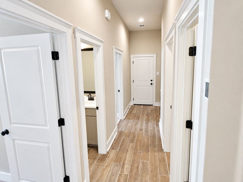 DSLD HOMES NEW CONSTRUCTION MOVE IN READY HOME IN LONGLEAF COMMUNITY LOCATED IN LUMBERTON, TX - Hallway