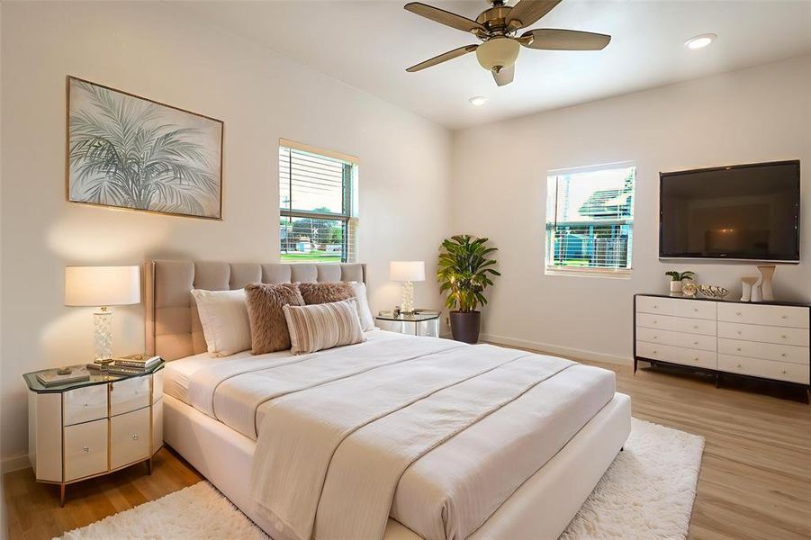 Bedroom with light wood-style flooring, recessed lighting, and ceiling fan