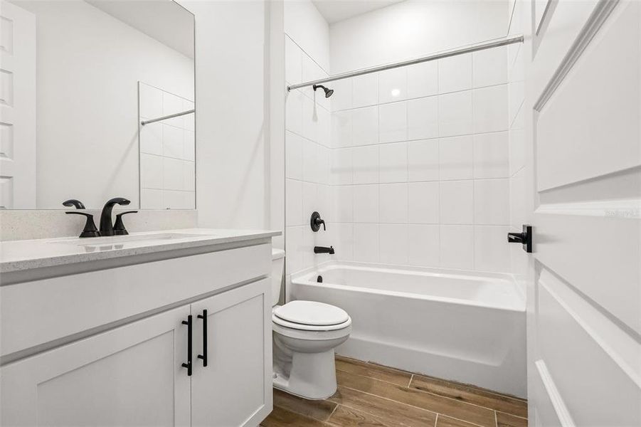Furnished interior view inside a new home in The Grove at Stuart Crossing - Signature Series, Bartow (Image 14).