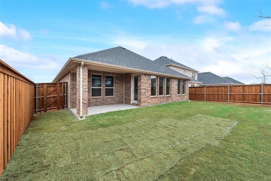 Exterior details and patio area of a home in Spiritas Ranch, Little Elm (Image 21).