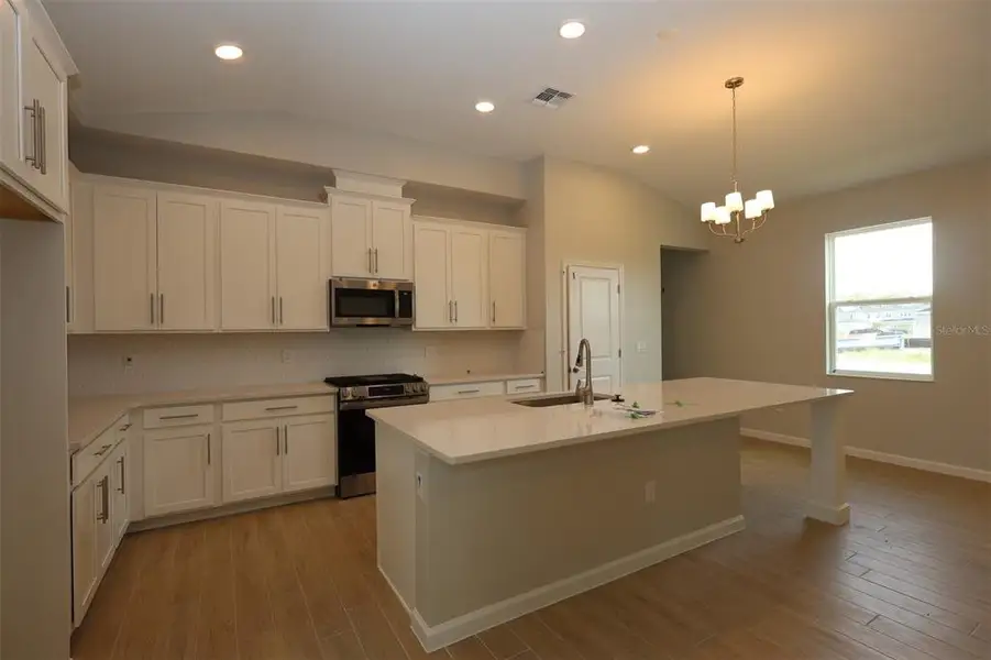 Furnished interior view inside a new home in Center Lake on the Park, St. Cloud (Image 14).