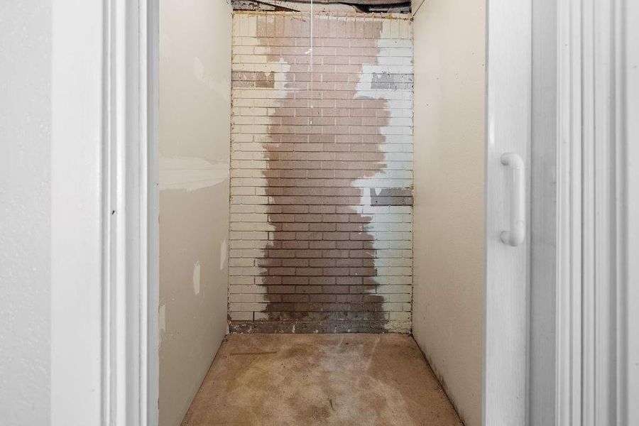 Walk in closet in primary bedroom