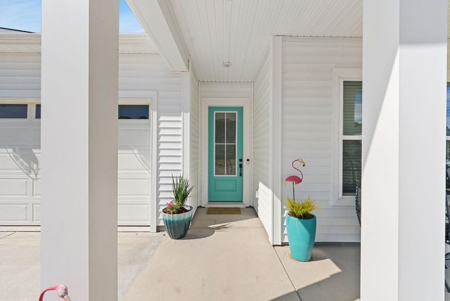 Exterior details and patio area of a home in Summerwind Crossing at Lakes of Cane Bay, Summerville (Image 31).