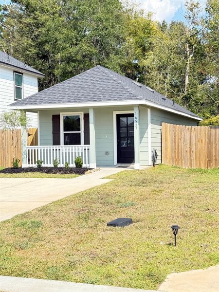 Front exterior of a new home in Marie Village, Conroe, TX, highlighting curb appeal (Image 1). Front exterior of a new home in Marie Village, Conroe, TX, highlighting curb appeal (Image 1).