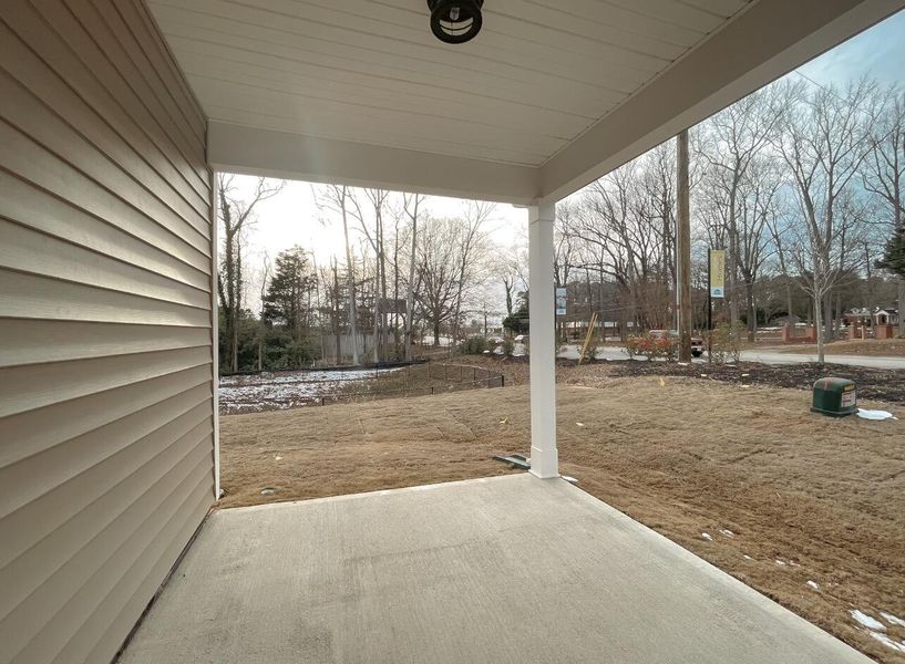 Exterior details and patio area of a home in East Main Townes, Spartanburg (Image 2).