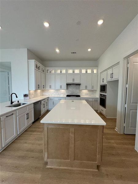 Kitchen with upgraded stacked upper cabinets and under counter lighting!