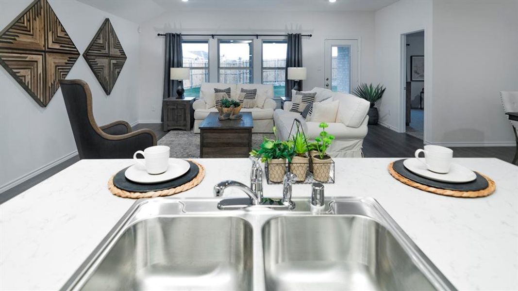 Kitchen view of a sink and wood finished floors