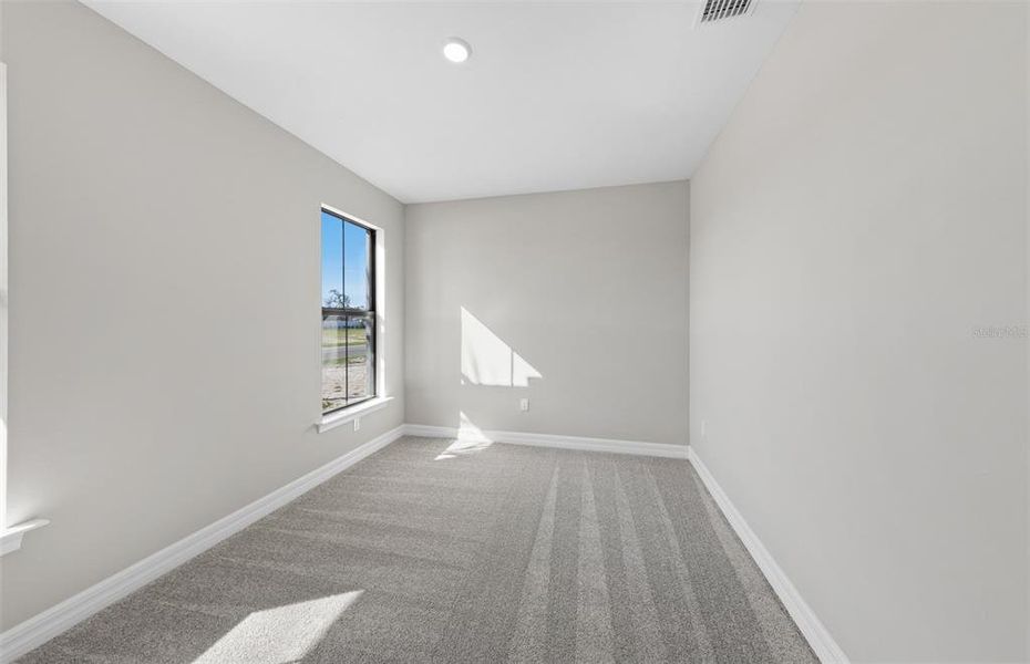 Spacious, unfurnished interior of a new home in The Strand at Cedar Grove, North Port (Image 30).
