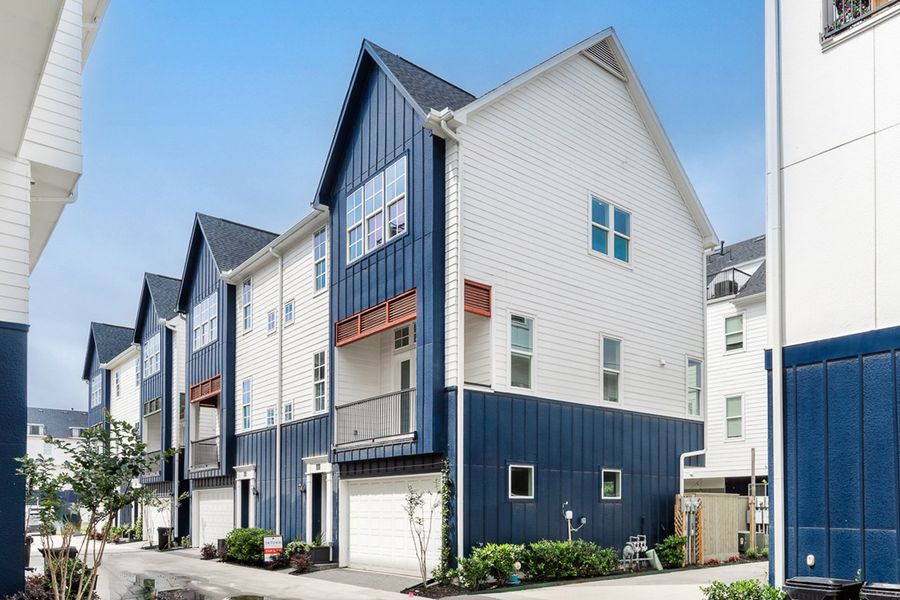 Front exterior of a new home in Upper East River, Houston, TX, highlighting curb appeal (Image 1).