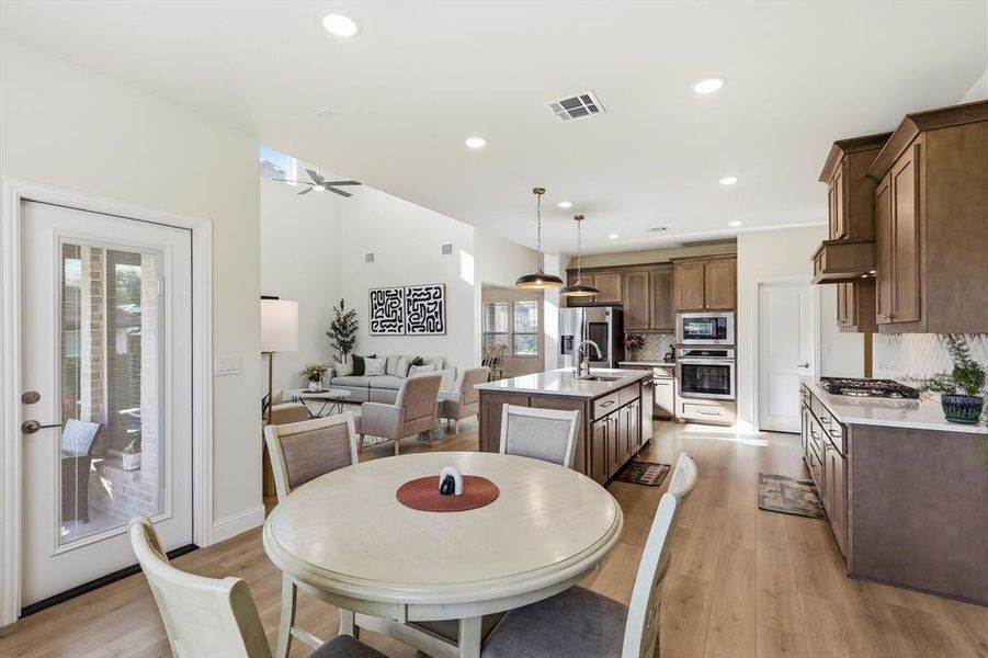 Breakfast area looking into the Gourmet Kitchen and the high ceiling Family room