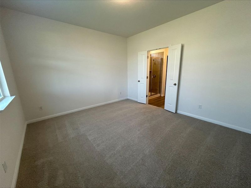Unfurnished room featuring carpet and baseboards Unfurnished room featuring carpet and baseboards