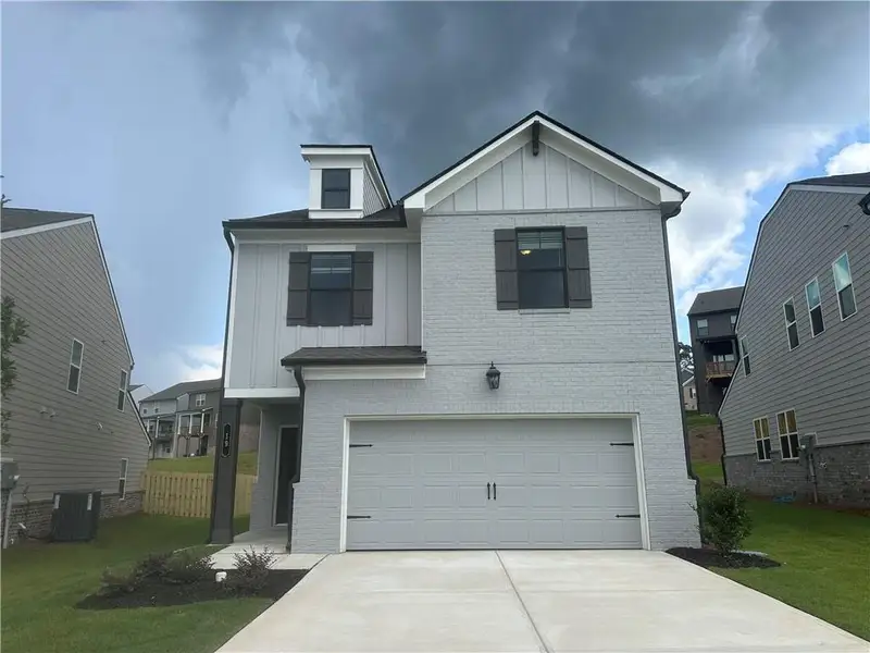 Front exterior of a new home in Kentmere, Auburn, GA, highlighting curb appeal (Image 2). Front exterior of a new home in Kentmere, Auburn, GA, highlighting curb appeal (Image 2).