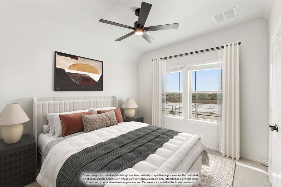 Bedroom with vaulted ceiling, ceiling fan, upholstered bed, and large windows with outdoor views