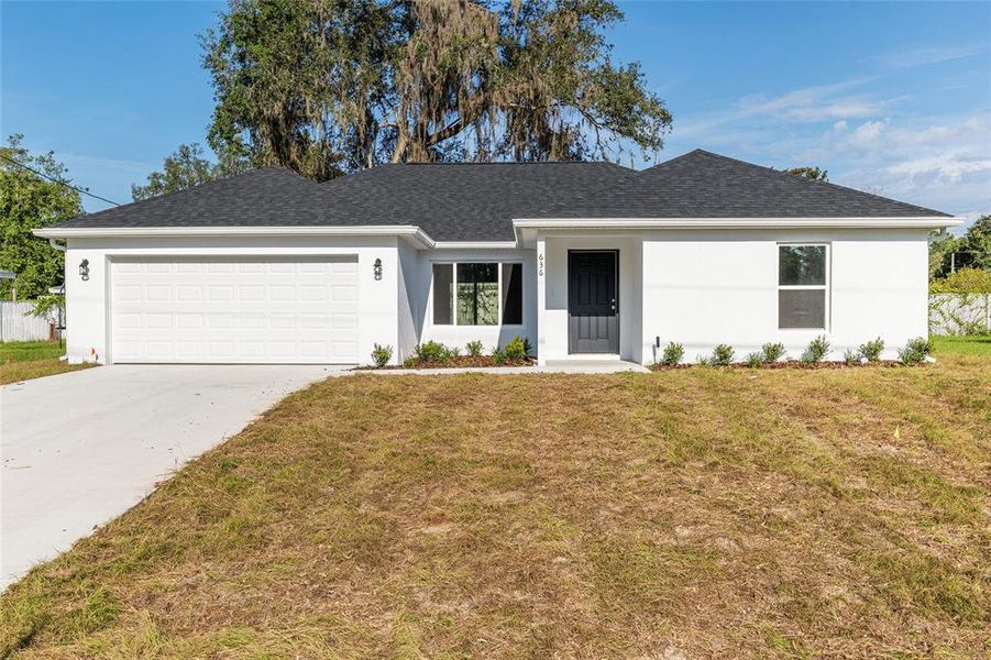 Front exterior of a new home in , Ocala, FL, highlighting curb appeal (Image 31).