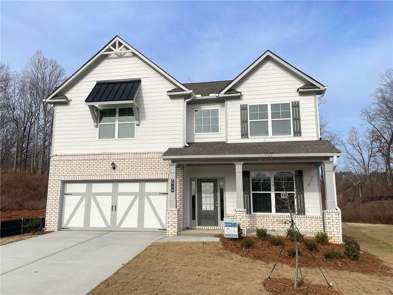 Front exterior of a new home in Clark Farms, Flowery Branch, GA, highlighting curb appeal (Image 1). Front exterior of a new home in Clark Farms, Flowery Branch, GA, highlighting curb appeal (Image 1).
