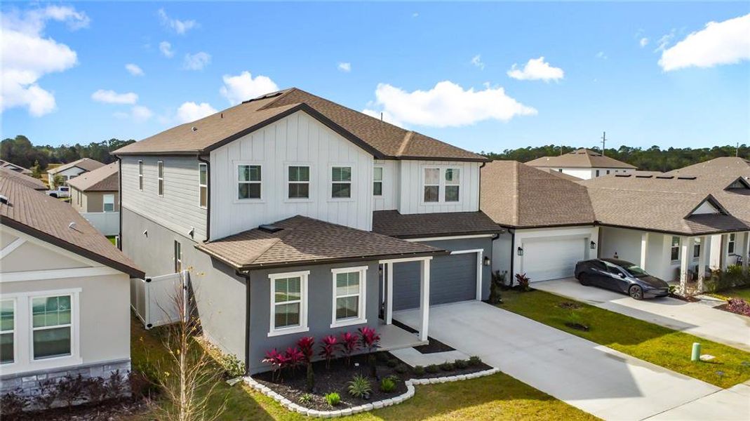 Front exterior of a new home in Sunbrooke, St. Cloud, FL, highlighting curb appeal (Image 28).