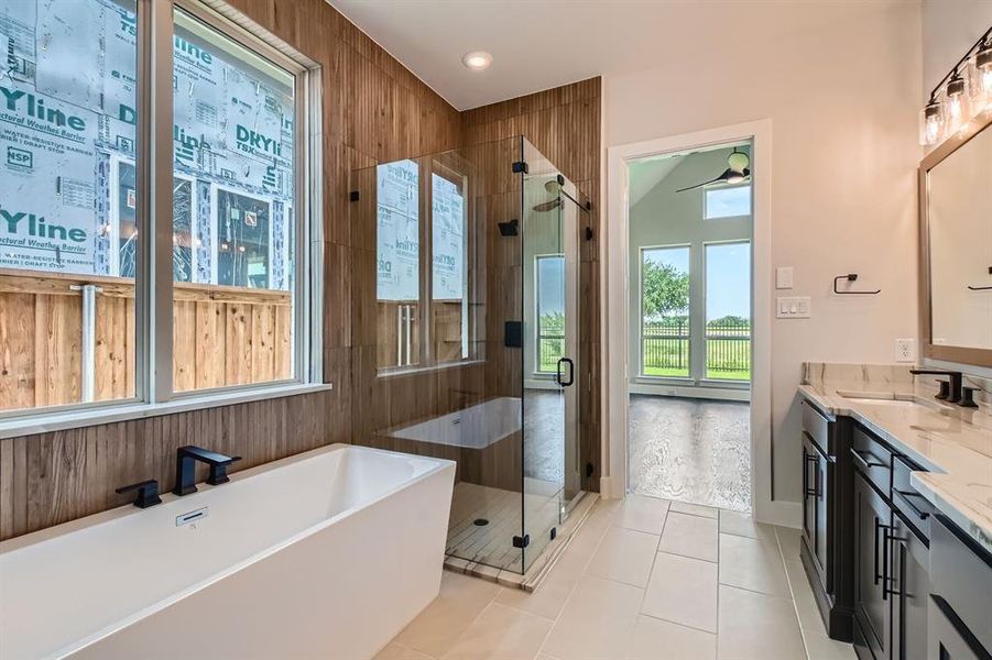 Bathroom with a shower stall, a soaking tub, vanity, and tile patterned floors Bathroom with a shower stall, a soaking tub, vanity, and tile patterned floors