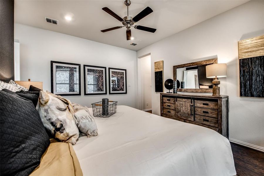 Bedroom featuring ceiling fan and dark wood-style floors