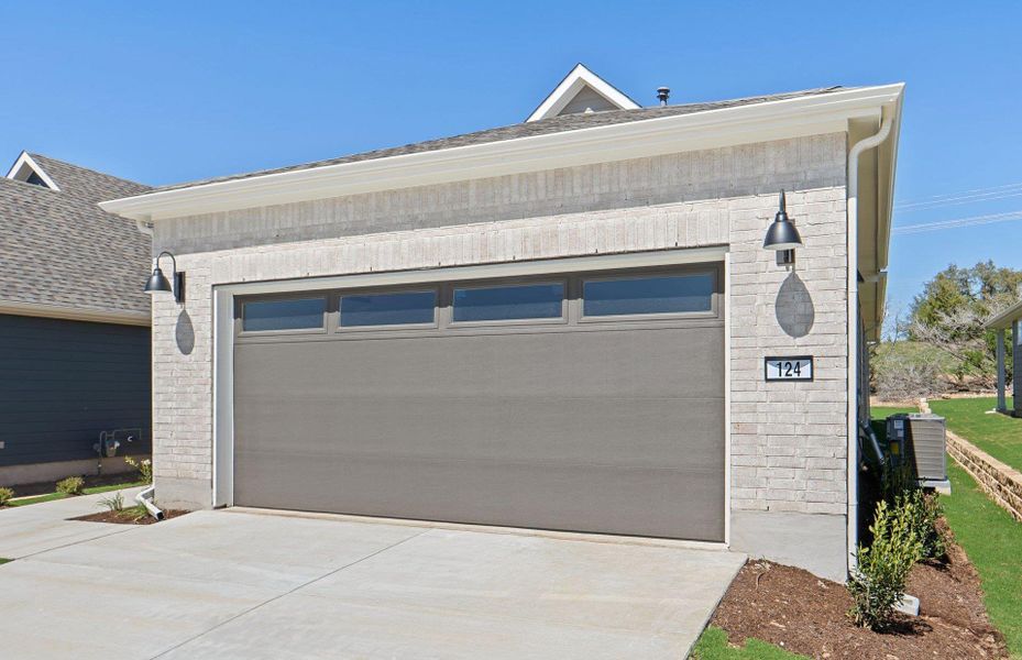 Front exterior of a new home in Sun City Texas, Georgetown, TX, highlighting curb appeal (Image 18).