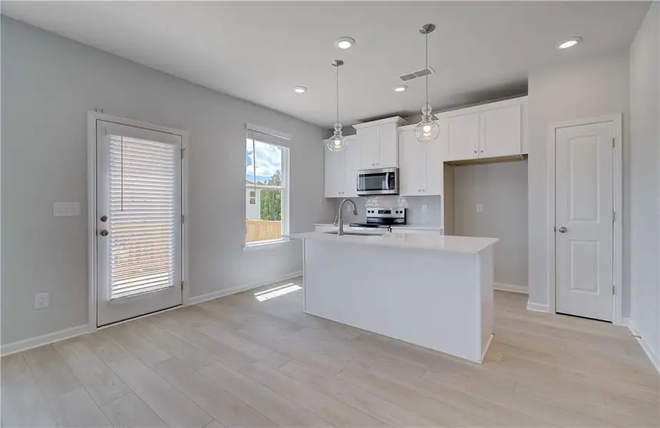 Furnished interior view inside a new home in Enclave at Evergreen, Fairburn (Image 3).