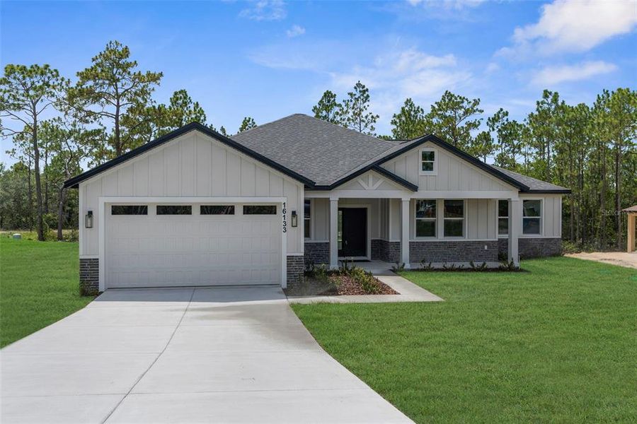 Front exterior of a new home in , Weeki Wachee, FL, highlighting curb appeal (Image 31).