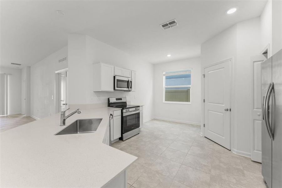 Furnished interior view inside a new home in Peace Creek Reserve, Winter Haven (Image 11).