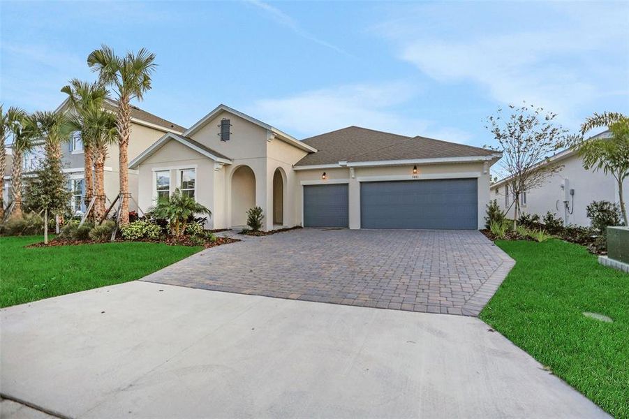Front exterior of a new home in Seaire, Parrish, FL, highlighting curb appeal (Image 22).