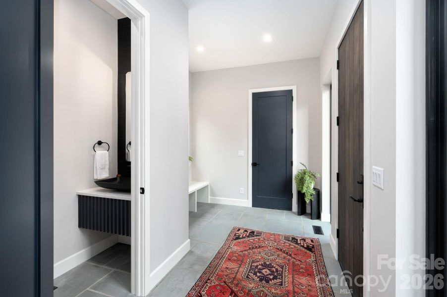 Beautifully Unique Dogtrot Entry with Blue Stone Flooring and Powder Room