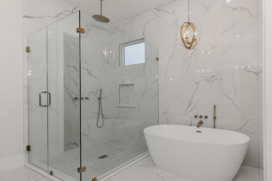 Relax in the Stand Alone Soaking Tub or Frameless, Oversized Shower Relax in the Stand Alone Soaking Tub or Frameless, Oversized Shower