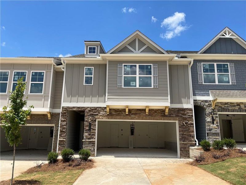 Front exterior of a new home in Porter Reserve, Decatur, GA, highlighting curb appeal (Image 2). Front exterior of a new home in Porter Reserve, Decatur, GA, highlighting curb appeal (Image 2).