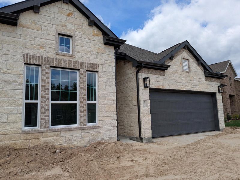 Exterior details and patio area of a home in Artavia, Conroe (Image 3).